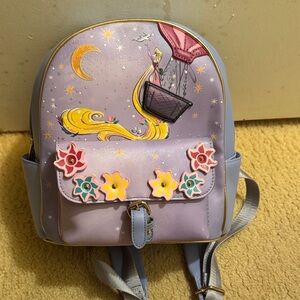 This is a Danielle Nicole Disney Tangled Air Balloon Mini Backpack